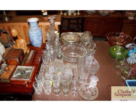 A quantity of various glassware to include a triple ring necked decanter, various cruet bottles, fruit bowls, table glass etc