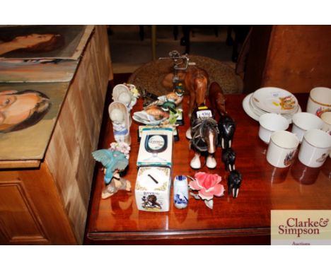 A collection of various ceramic and wooden animal ornaments; a Guinness goblet; a golfing figure etc. 