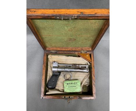A vintage Webley chrome air pistol., showing signs of plating loss 1952 made. 0.22'' bore in oak box (non standard)