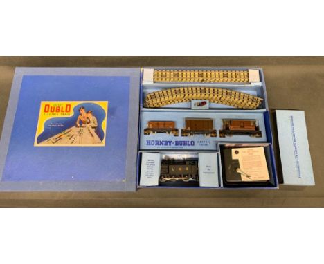 A vintage HORNBY Dublo electric train set. Box mint and engine near mint