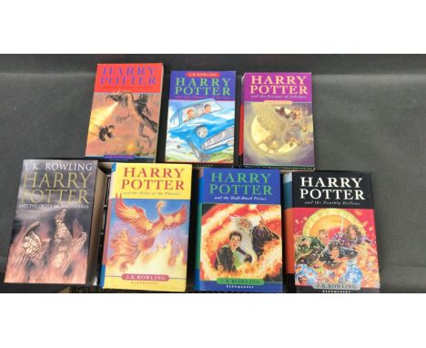 A collection of seven Harry Potter books      Adult edition of The Order of The Phoenix, Hard back, first edition       The O