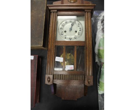 Stained wall clock with silvered dial