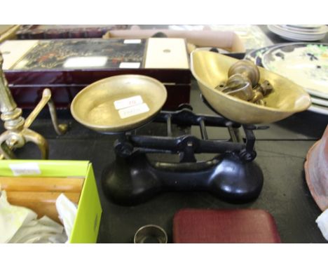 Set of scales with brass bowls and weights