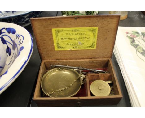 Wooden box containing Avery scales and weights