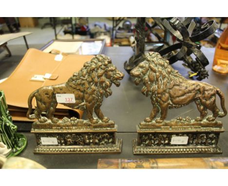 Pair c19th cast bronze fire ornaments - 'The British Lion'
