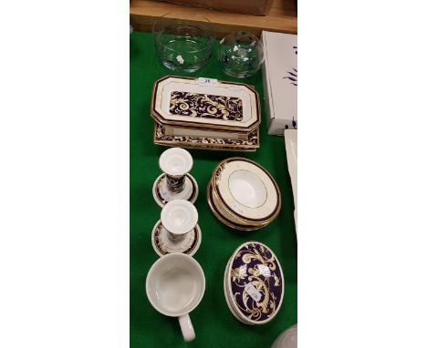 A collection of Wedgwood Cornucopia wares to include three pairs of dishes, a pair of candlesticks, oval trinket dish and cov