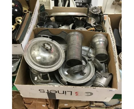 A collection of 18th, 19th and 20th Century pewter wares to include soup tureen, dutch measures, plate warmer, mugs, Malayan 
