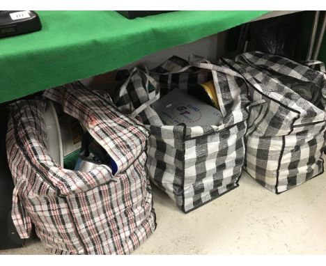 Three bags of various camping requisites including portable gas stove, flasks, modern boot jack, undersheet, sleeping bag, ma