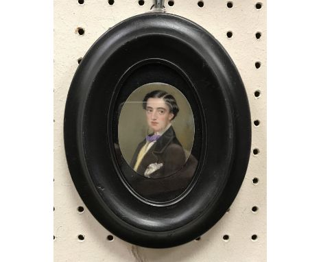 ENGLISH SCHOOL "Young man in violet bow tie and black jacket" a portrait study miniature oil on ivorine panel oval, unsigned