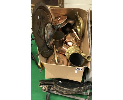A box of metal wares to include a gilt candlestick with scrolling decoration, a brass ecclesiastical collection plate, variou