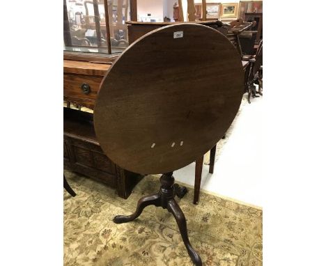 A late George III mahogany tea table, the circular snap on a birdcage to turned pedestal and tripod base