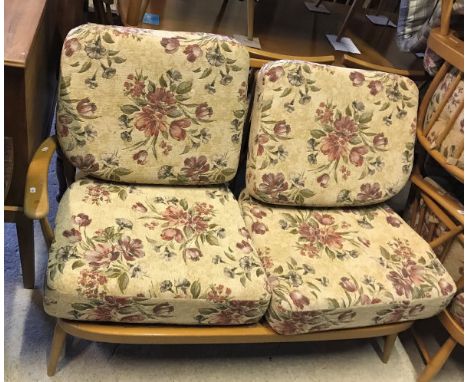 An Ercol "Windsor" beech framed two seat sofa, circa 1966, later re-upholstered in fire retardant material 2002, together wit