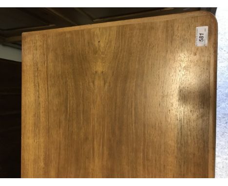 A Gordon Russell teak sideboard with three central drawers flanked by two cupboard doors, bears "Russell of Broadway" label v
