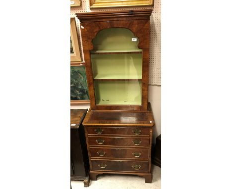 A walnut and inlaid cabinet on chest in the 18th Century style the single glazed door enclosing two shelves over four long dr