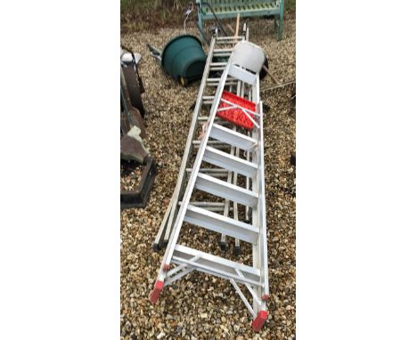 A collection of modern garden tools to include green bucket and a garden seeder, together with two double aluminum ladders