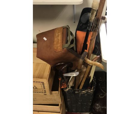 A cane stick stand together with various umbrellas, walking sticks, hockey sticks, gun sleeve, faux crocodile skin bag by Bel