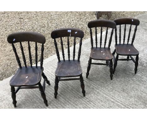 A set of four small stained beech stick back kitchen chairs, a slat back kitchen chair and another stick back chair CONDITION