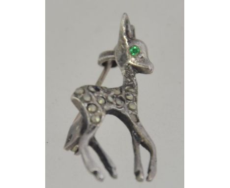 A vintage silver brooch in the form of a deer - bambi having garnet stone eyes and pin back. Weight approx 2g