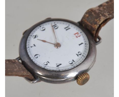 A silver vintage wristwatch with enamel set face having leather strap. The face with faceted hands. Total weight 25.1g