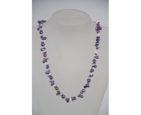 A baroque contemporapy pearl and glass necklace with silver lobster claw clasp. Size 50cms
