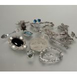 A collection of white metal and silver jewelry including circular pierced brooch, a oval filigree