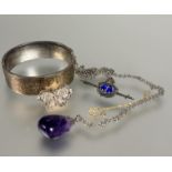 An Edwardian style silver stiff hinged bangle with 9ct gold front engraved panel, (D x 5.5 cm), a