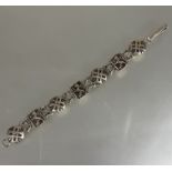 A Scottish silver rampant Lion and Celtic Targe alternating chain link bracelet, (D x 9 cm). 23g