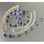 A lavender, lilac and clear alternating glass bead necklace, ( L x 14 cm) and matching bracelet, a