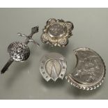 A Edwardian Birmingham silver square panel shaped brooch, a white metal crescent shaped brooch, a