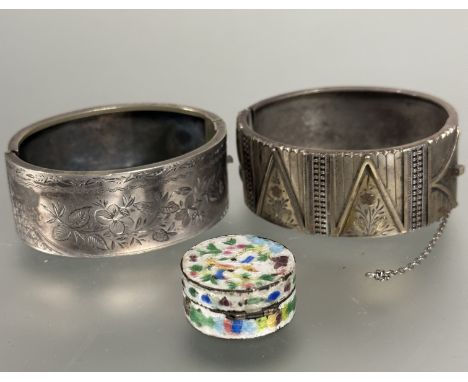 A silver Edwardian stiff hinged bangle with engraved floral panels and safety chain, (H x 2.5 cm x D 6 cm) a Edwardian stiff 