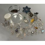 A collection of silver and white metal charms including a hedgehog,lion, top-hat, tankard, ballet