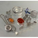 A collection of silver and white metal jewelry including two oval carnelian brooches, a pair of