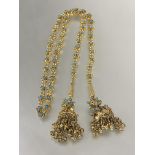 A Indian style gilt metal floral chain link open tassel necklace with inset turquoise ceramic