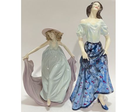 A ceramic Royal Doulton 'Carmen' figure of a lady (marked verso, h- 29cm), together with a Lladro figure of a lady (marked ve