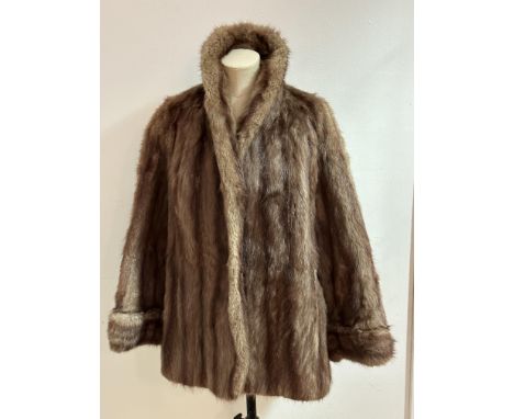A vintage Musquash Lady's swing jacket with fold over collar, folded cuffs and slash pockets to side, satinised lining, no vi