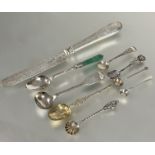 A collection of six various white metal and silver salt and mustard spoons, including a Georgian