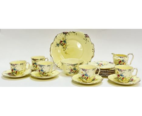 A Royal Staffordshire gilt part tea service with floral decoration comprising five cups, six saucers, six small plates (w- 17