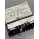 A Lady's 1900 Vintage 9ct gold oval shaped Swiss wristwatch with silver engine turned dial and