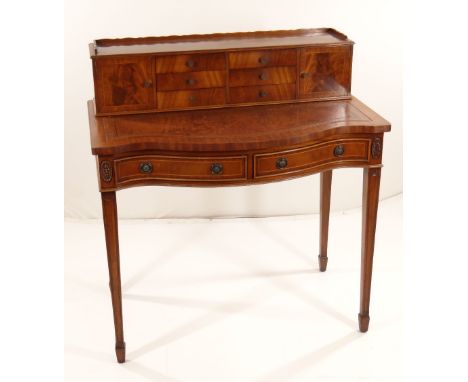 REPRODUCTION GEORGIAN-STYLE MAHOGANY BONHEUR DU JOUR, with superstructure of drawers and cupboards, on a serpentine fronted a