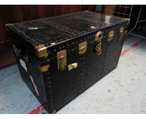 VINTAGE STEAMER TRUNK with brass plated locks and corner clasps, leather handles