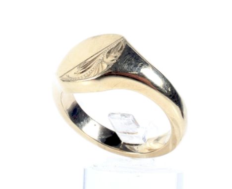 A modern 9ct gold oblong signet ring. The head part floral engraved, on a tapering D-section shank, post 2000 London conventi