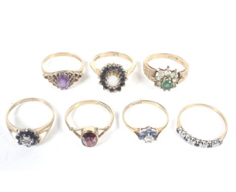 Seven vintage 9ct gold and gem-set rings. To include an oval amethyst single stone, size P; a white opal and dark-blue sapphi