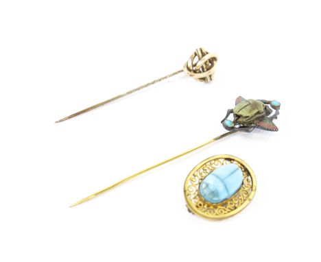 Three Victorian and later items of jewellery. Including a gold knot and bar stick pin,  unmarked; an Egyptian silver, enamel 