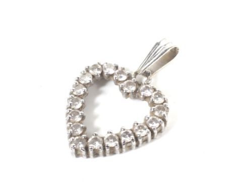 A vintage diamond open-heart pendant. The 18 round brilliants all claw set in white stamped '14K', 1.6g gross