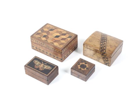 A collection of Tunbridgeware. Comprising a parquetry box, a stick ware stamp box with butterfly, a semi-domed hinge lidded b