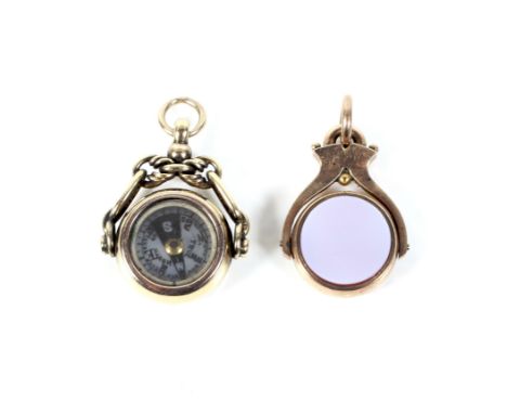 An early 20th century 18ct gold cased spinning fob. With an anchor-link surmount and set with a bloodstone and a compass, hal