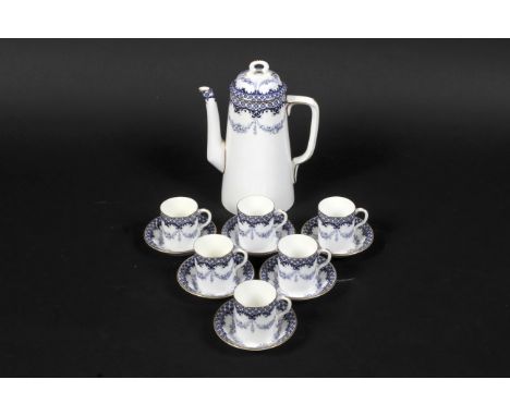 A Royal Worcester, puce mark, a coffee set. Comprising of coffee pot and six cups and saucers, all with blue diaper and swag 