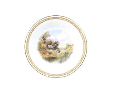 A Royal Worcester plate with impressed mark. Hand painted scene of donkeys and gilded rim, 22.8cm diameter