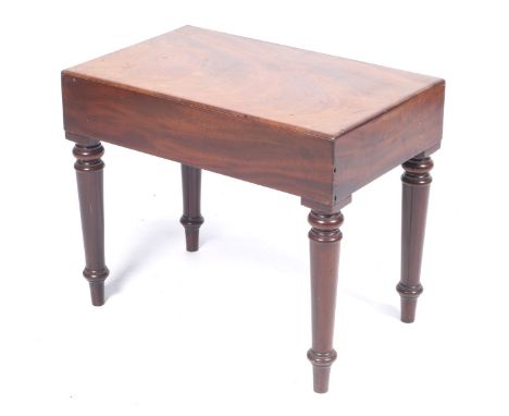 A 19th century mahogany bidet. Raised on turned supports, no basin present, H47cm x W57cm x D36cm