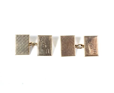 A pair of vintage 9ct gold rectangular twin-panel cufflinks. Each link comprising two rectangular panels of which one is engi